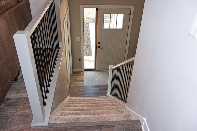 foyer entrance featuring dark hardwood / wood-style floors