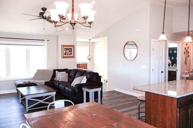 living room featuring lofted ceiling, dark hardwood / wood-style floors, and a notable chandelier