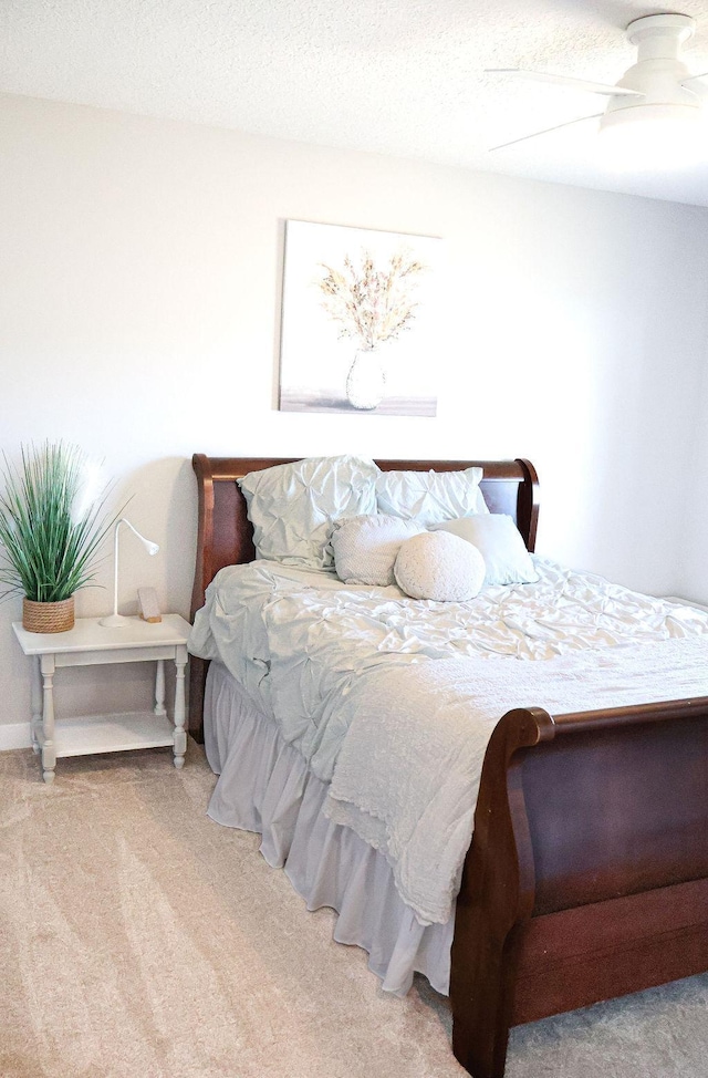 carpeted bedroom with a textured ceiling