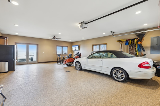 garage with baseboards, electric panel, recessed lighting, freestanding refrigerator, and a garage door opener