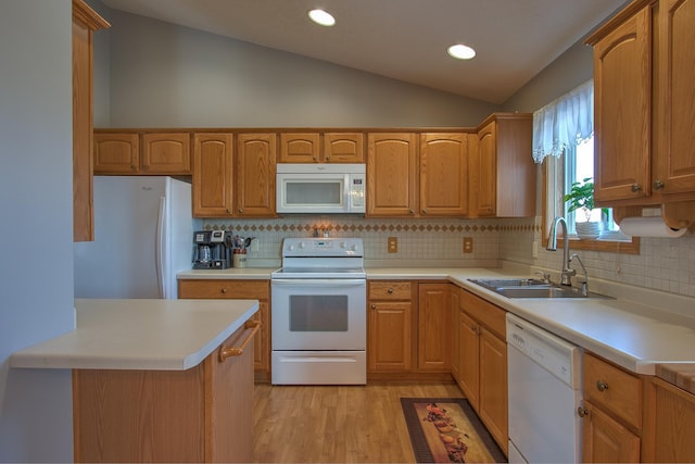 kitchen featuring sink, white appliances, light hardwood / wood-style flooring, decorative backsplash, and vaulted ceiling