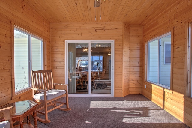 unfurnished sunroom with wood ceiling