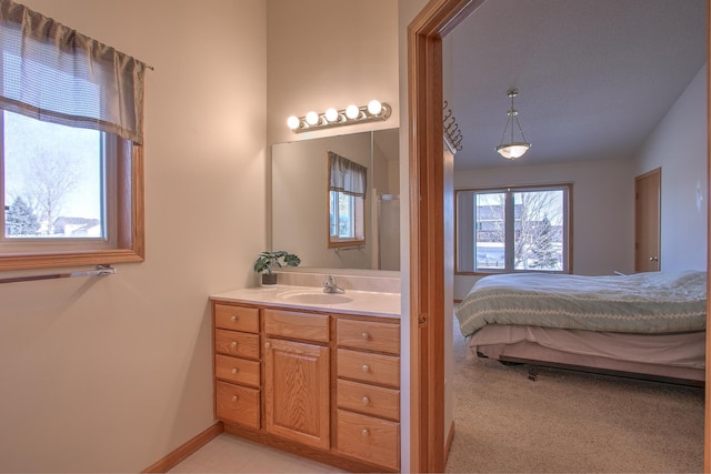 carpeted bedroom featuring sink