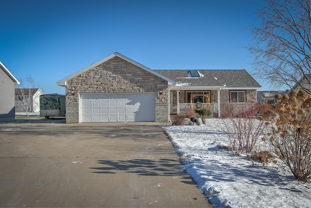 ranch-style home featuring a garage and a porch