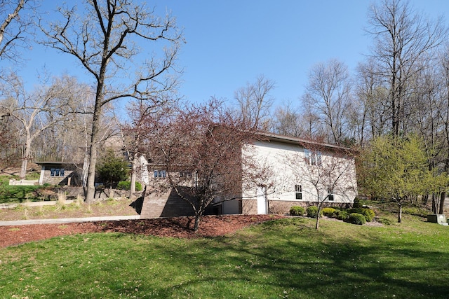 view of home's exterior featuring a lawn