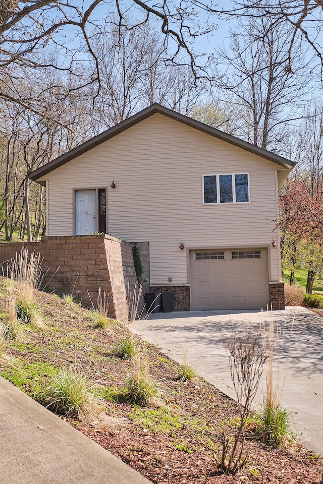 view of side of property with a garage