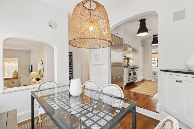 dining space featuring dark hardwood / wood-style flooring