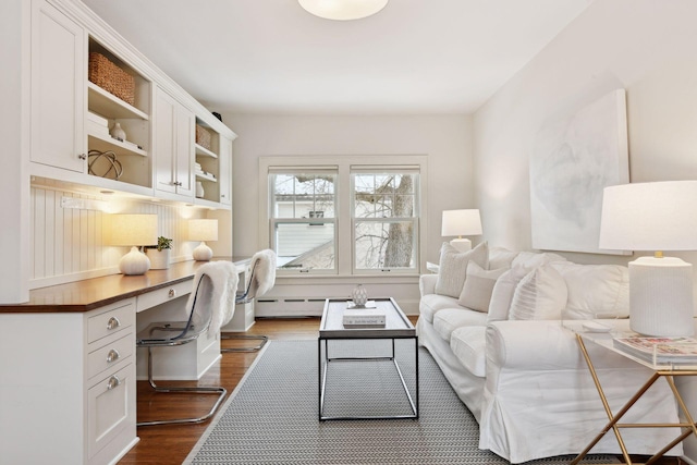 living room with dark hardwood / wood-style flooring and built in desk