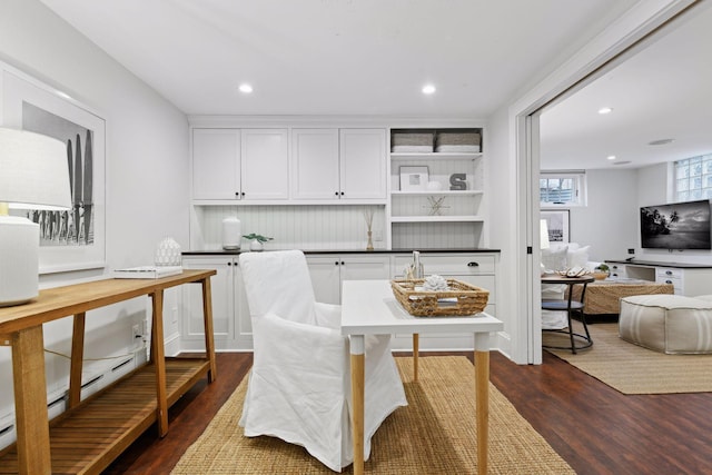 dining space featuring dark wood-type flooring