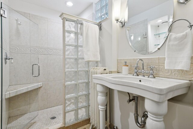 bathroom with a shower with shower door