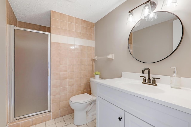 bathroom featuring tile patterned flooring, toilet, a textured ceiling, and walk in shower