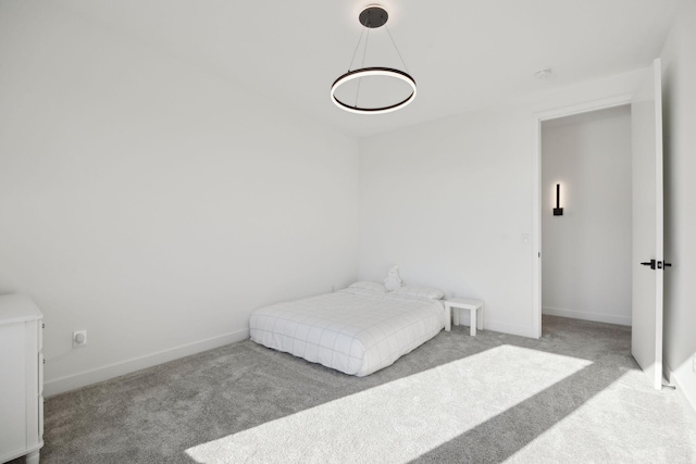 bedroom featuring light carpet