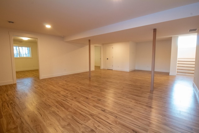 basement featuring light wood-type flooring