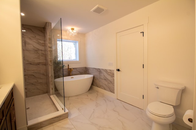 full bathroom with vanity, toilet, separate shower and tub, and tile walls