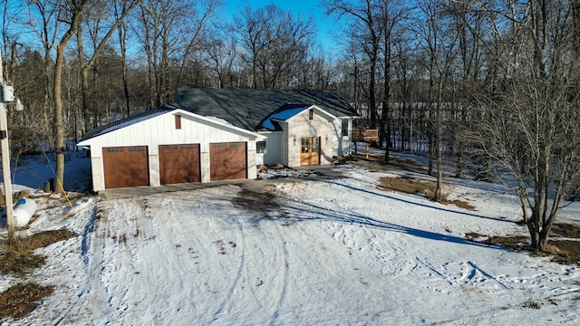 view of snow covered garage