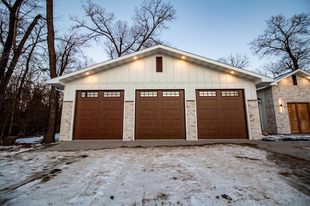 view of garage at dusk