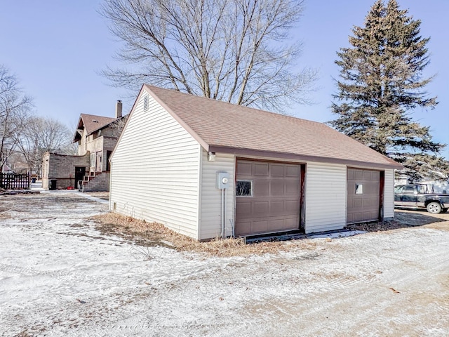 view of snow covered garage