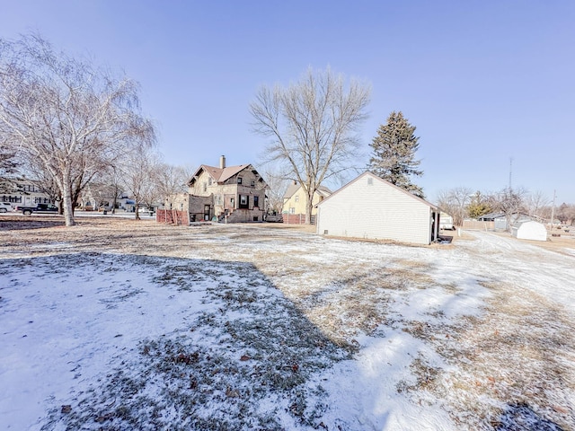 view of yard layered in snow