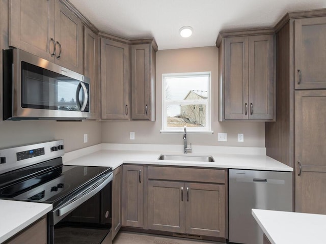 kitchen with appliances with stainless steel finishes and sink