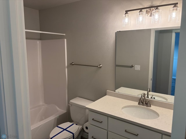 full bathroom featuring vanity, tub / shower combination, and toilet