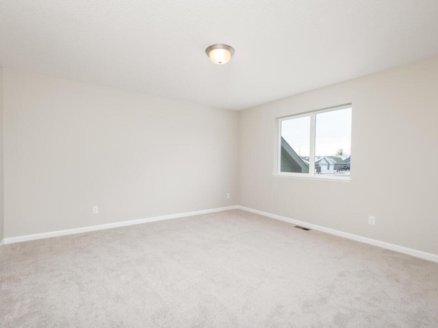 unfurnished room with carpet