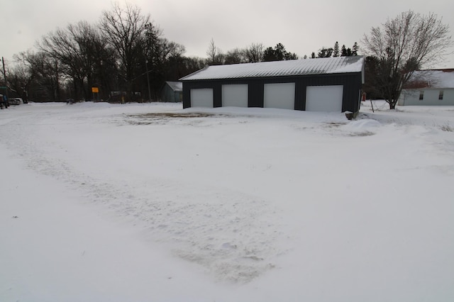 view of snow covered garage