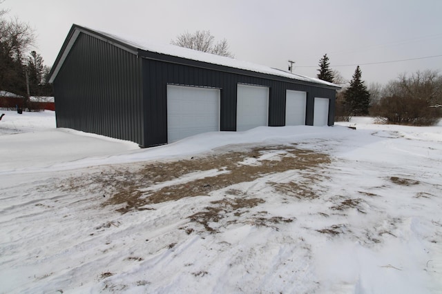 view of snow covered garage