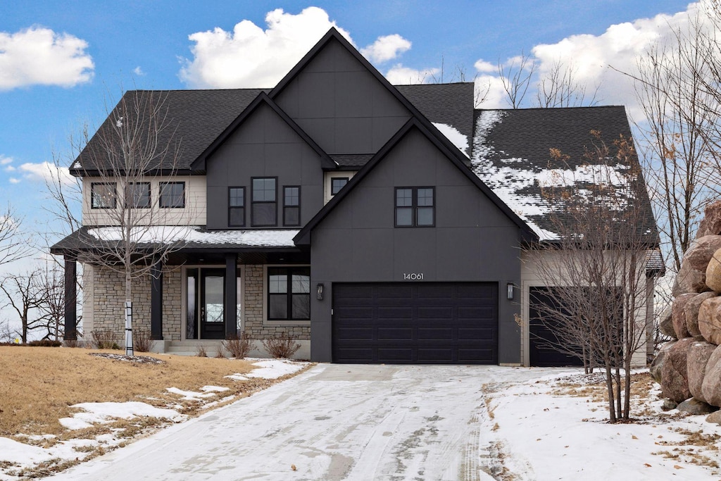 modern farmhouse style home with a garage