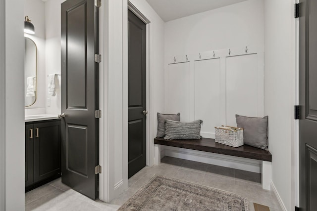 mudroom with light tile patterned floors