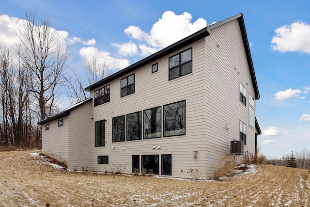 rear view of property featuring central air condition unit