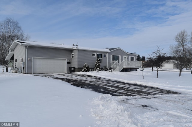 view of front facade featuring a garage and a deck