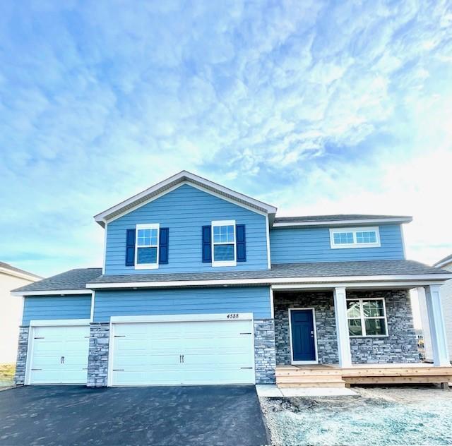 view of front of home featuring a garage and covered porch