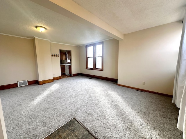 unfurnished living room featuring crown molding, carpet floors, and a textured ceiling