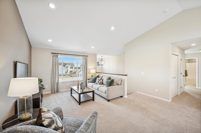 living room featuring vaulted ceiling, light carpet, and a notable chandelier