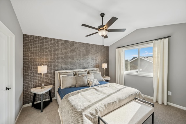 carpeted bedroom featuring brick wall, lofted ceiling, and ceiling fan