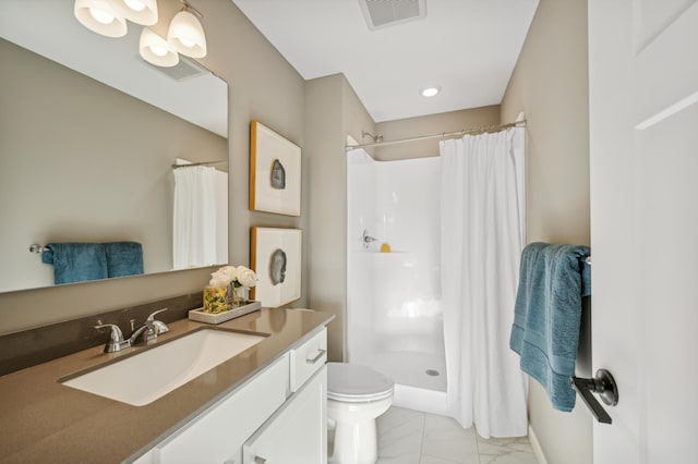 bathroom featuring vanity, a shower with curtain, and toilet