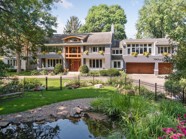 view of front of home featuring a garage and a front yard