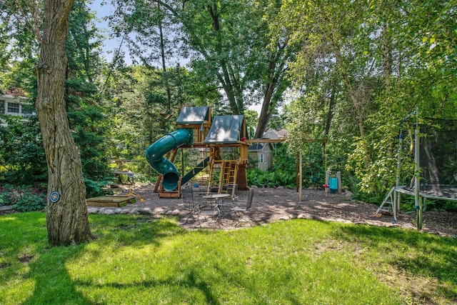 view of playground with a yard and a trampoline