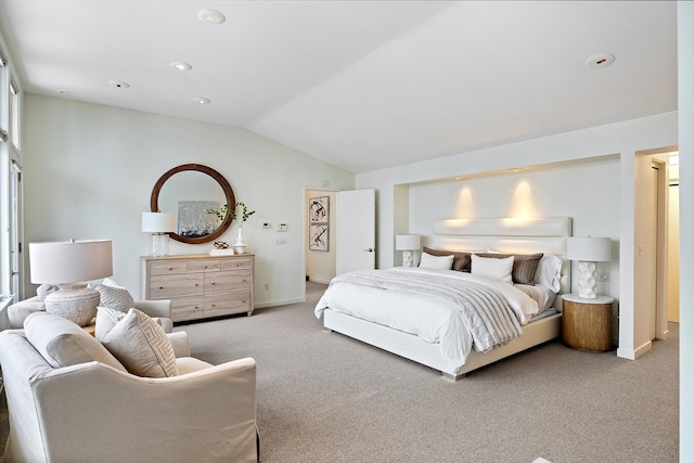 carpeted bedroom featuring lofted ceiling