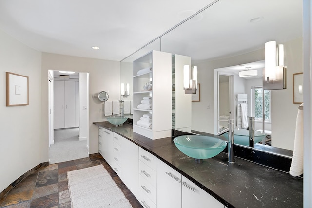 bathroom featuring vanity and a wall unit AC