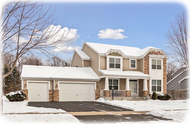 view of front of home featuring a garage and covered porch