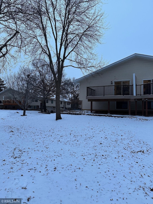 view of yard layered in snow