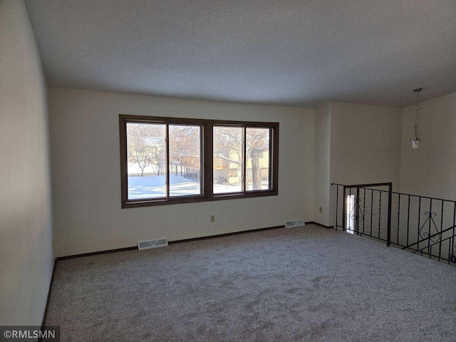 empty room with carpet flooring