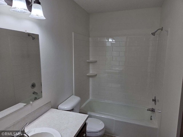 full bathroom with tiled shower / bath combo, vanity, and toilet