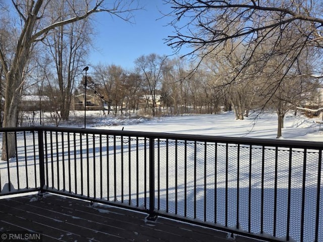 view of snow covered deck