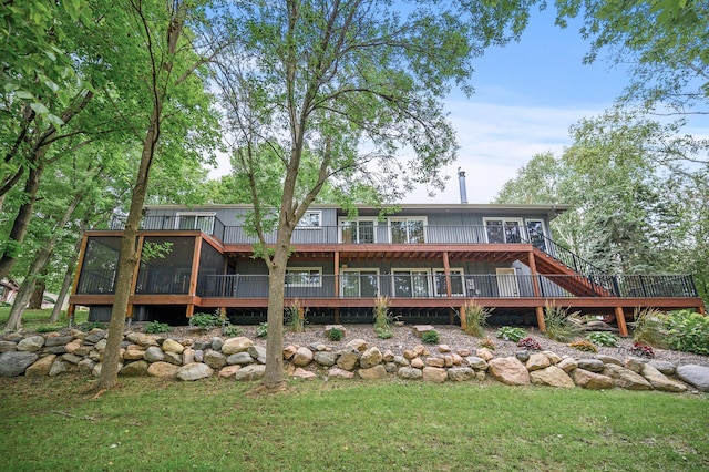 back of house with a wooden deck