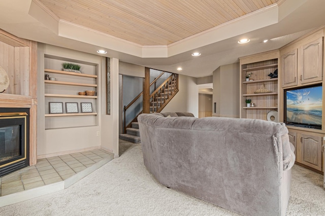 living room featuring crown molding, recessed lighting, a raised ceiling, and stairway