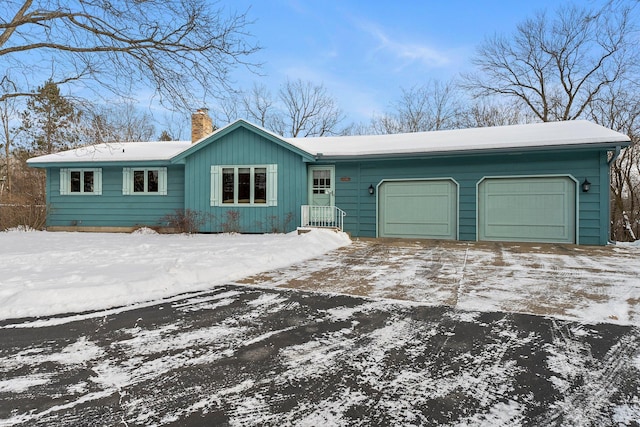 ranch-style house featuring a garage