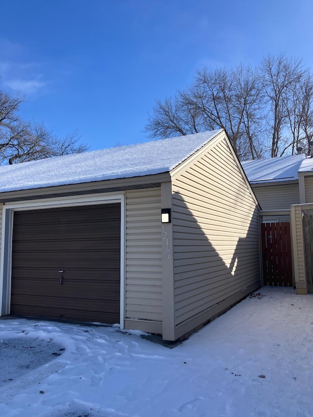 view of snow covered garage