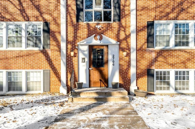 view of snow covered property entrance